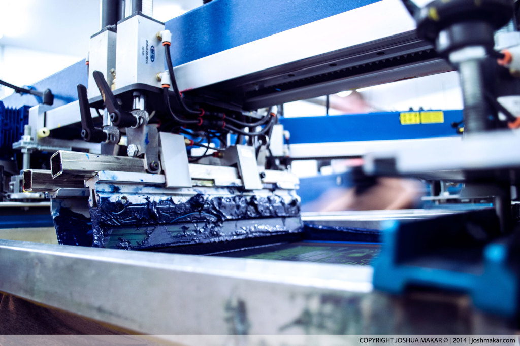 Color stop on screen-printing press with blue ink.